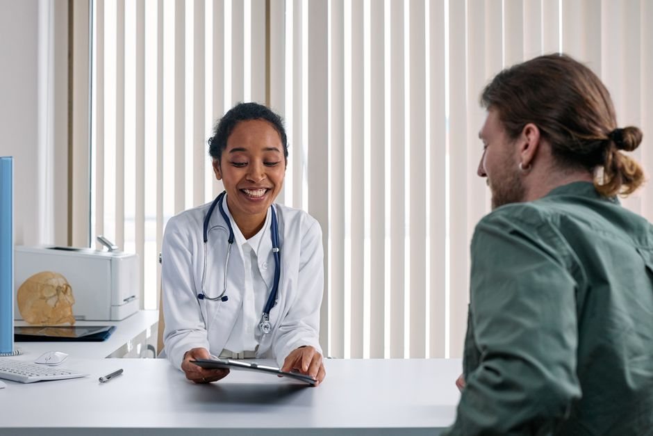 Physician consulting with a patient in clinic